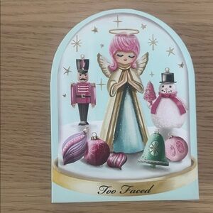 Too Faced Festive Angel Card with Pink and Green Ornaments